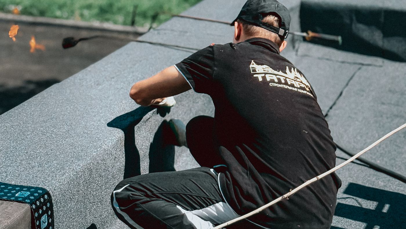roofer working on a flat roof